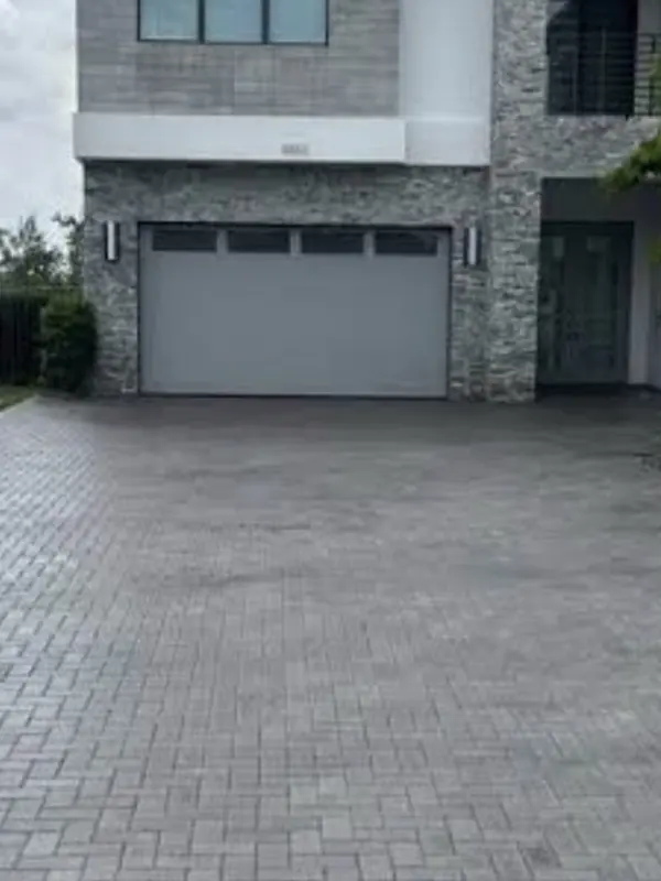 The same paver driveway rich in color after cleaning