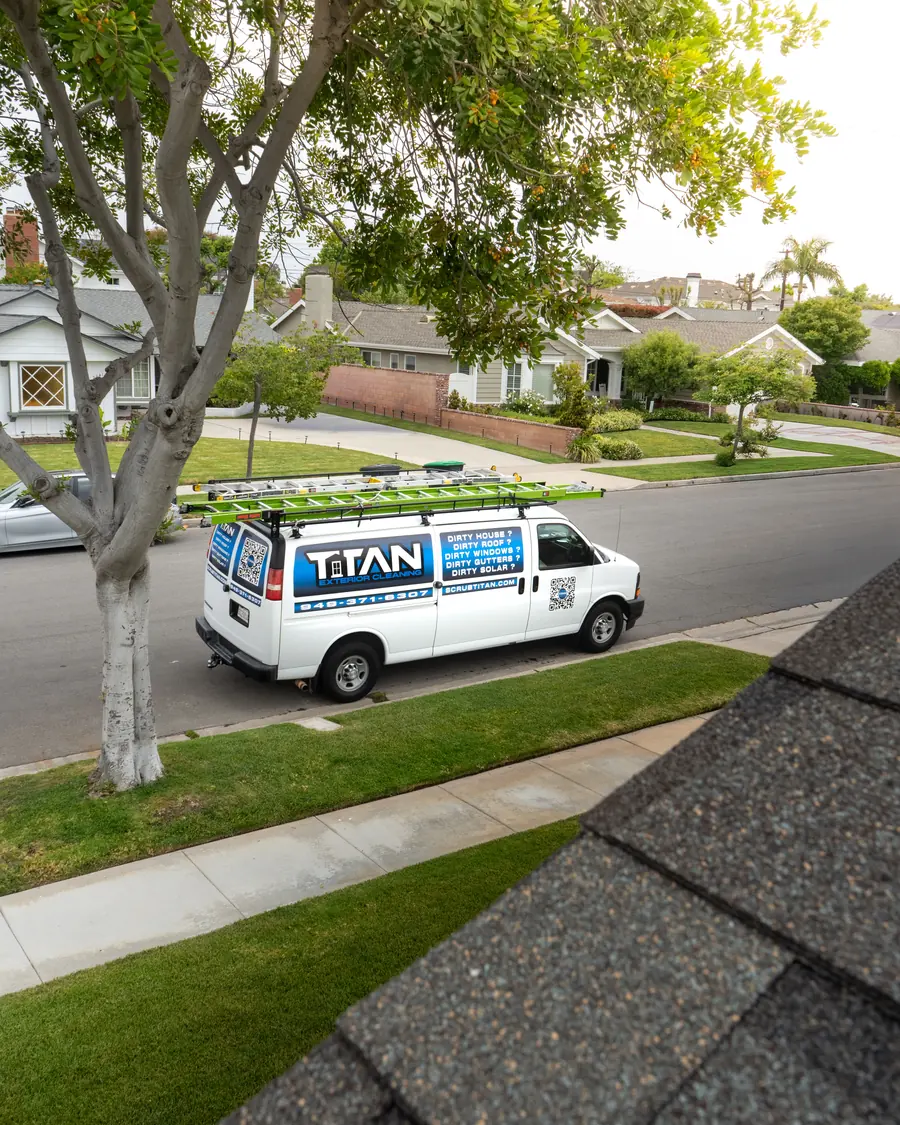 The Titan van parked on a residential street, seen from a roof