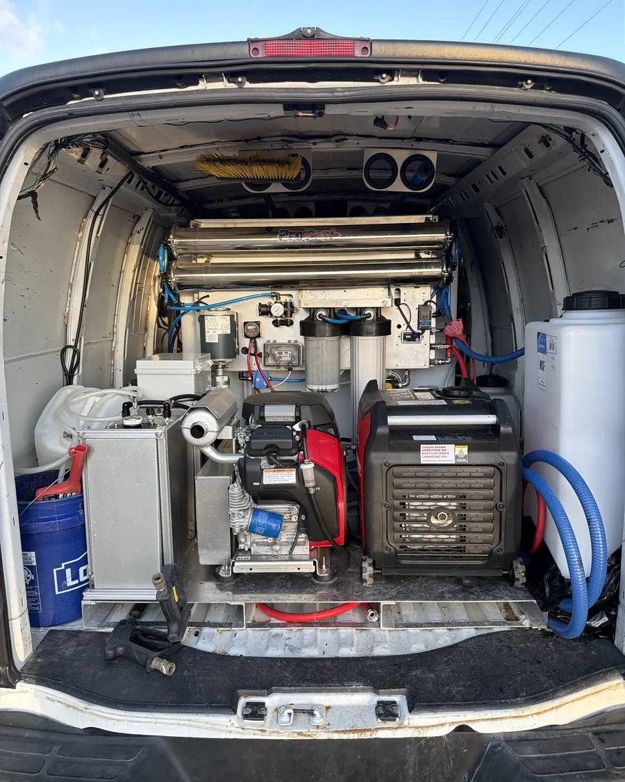 The back of the Titan van with its water purification system, pressure washer, generator, treatment tank and hoses