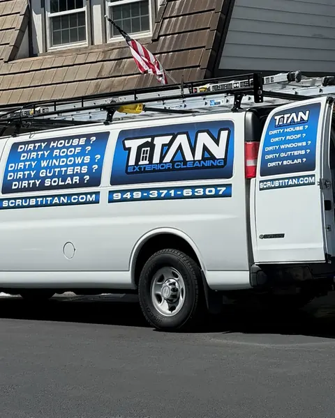 The Titan van parked at a job, side door open