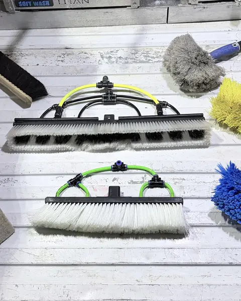 Window cleaning brushes, squeegees and tools laid out