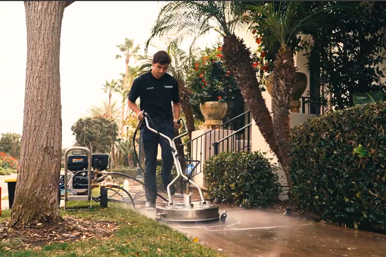 Titan cleaning a Sidewalk 